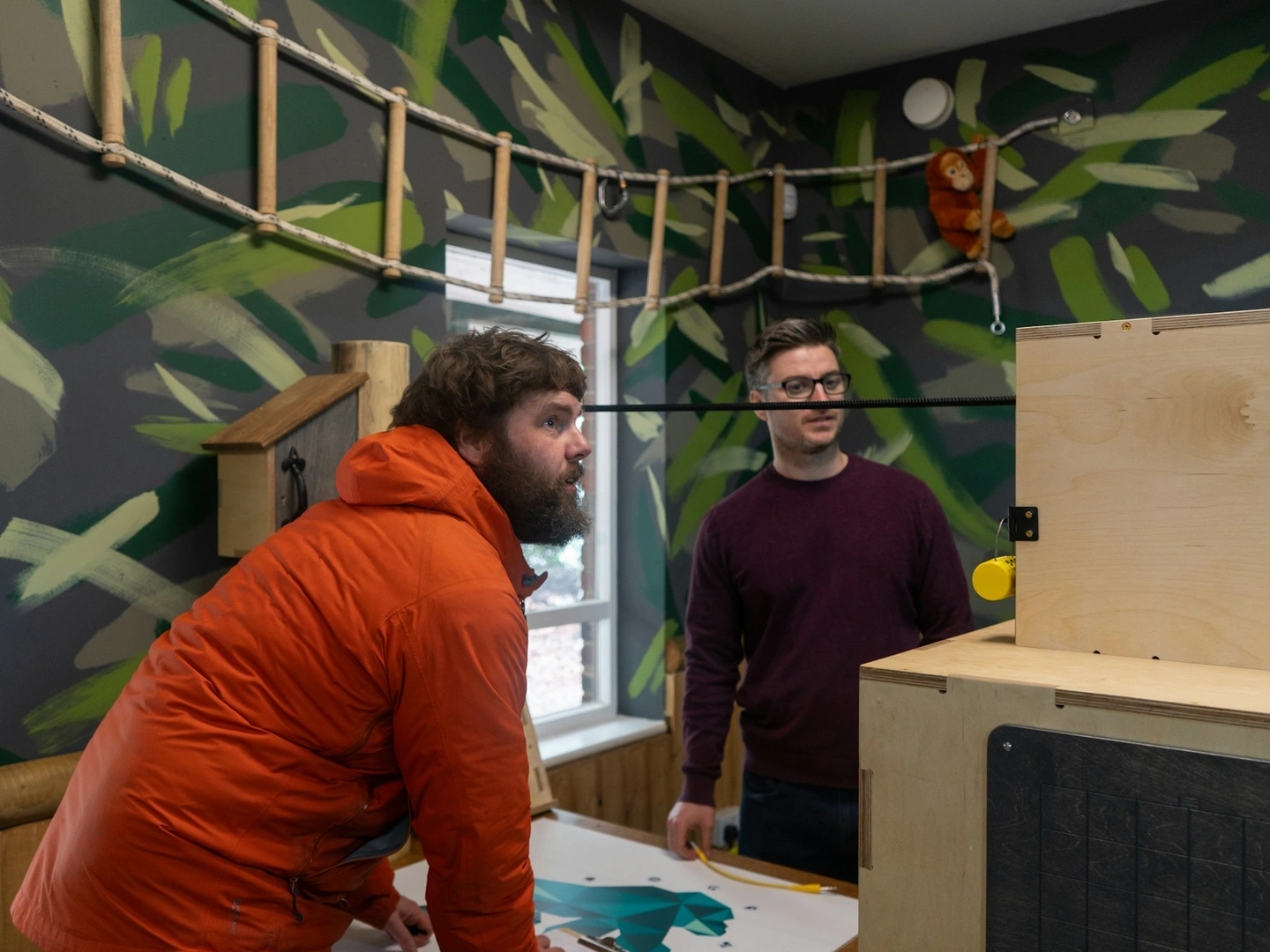 Two people solve a puzzle.