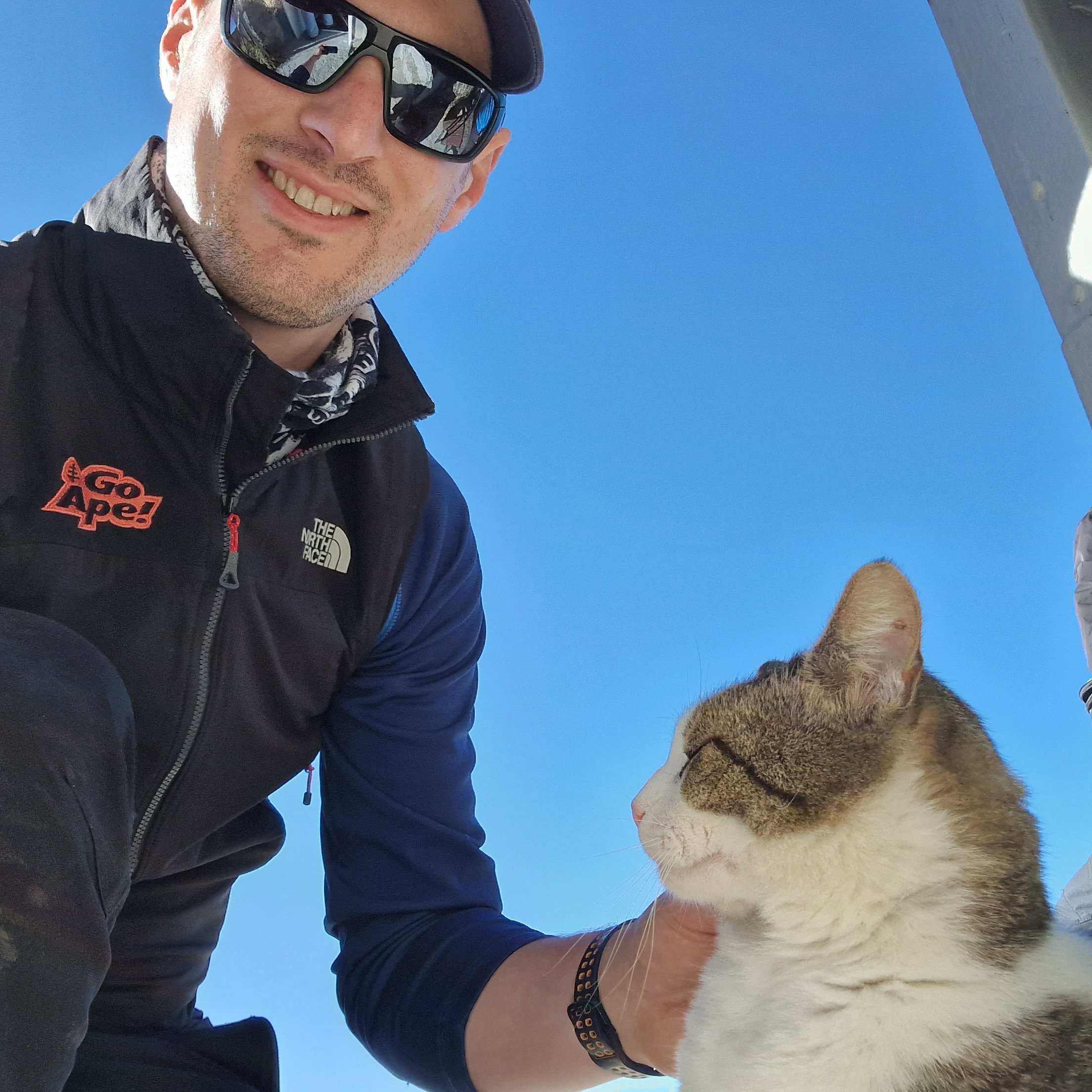 Go Ape co-owner and TEN Trek Musala team member Charlie on the mountain summit with the resident cat