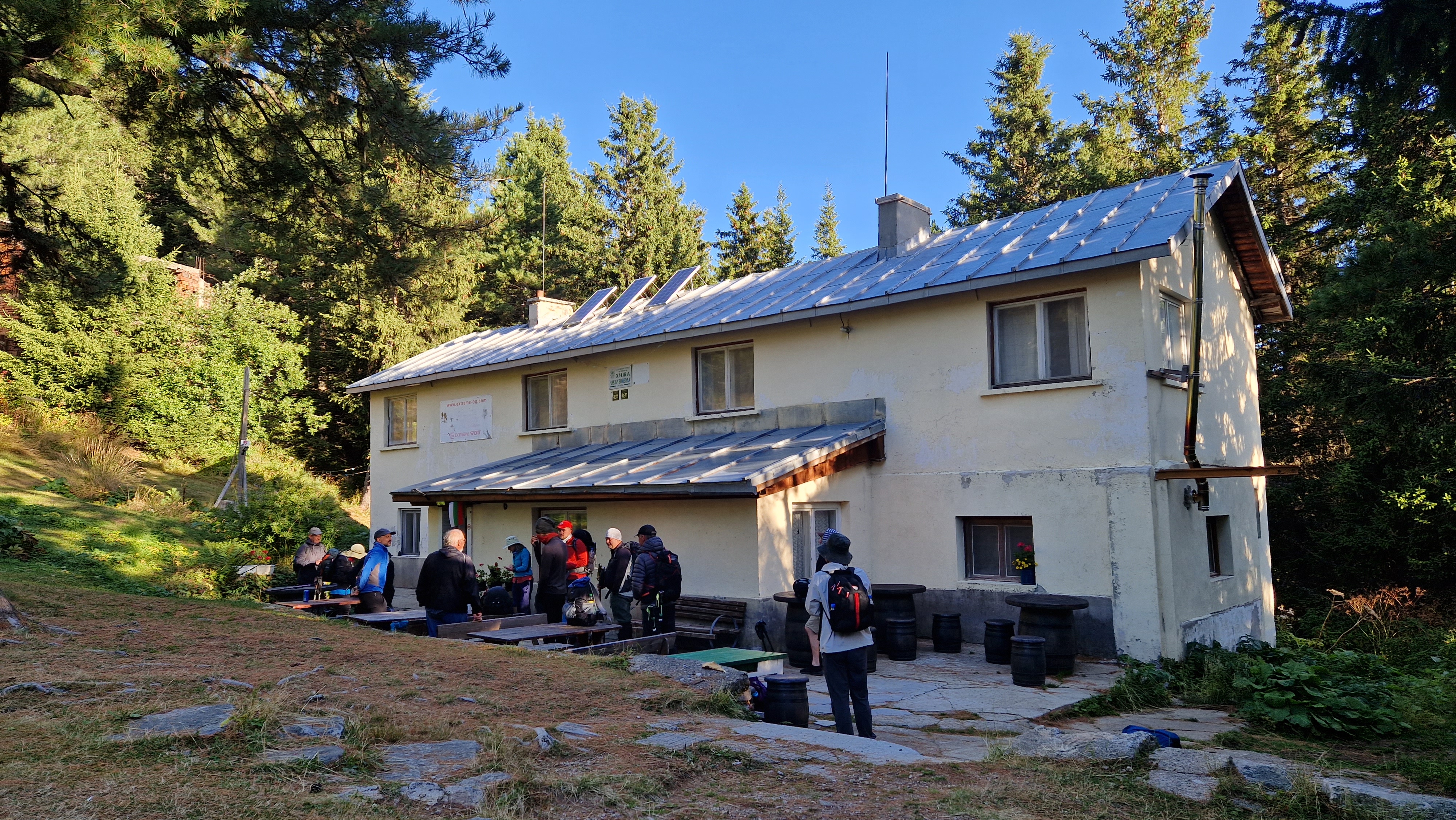 A mountain hut amongst a pine forest in the foothills of the Rila Mountains Bulgaria