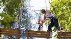 Woman and young girl on Go Ape Treetop Adventure crossing