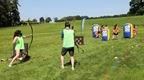 A group of people playing Go Ape Archery Tag