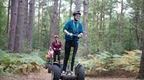 A man riding a Segways in a forest on a Go Ape experience