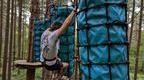 man in grey tshirt on Go Ape Challenge Plus blue cargo bags  | how to plan a stag do