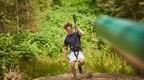 man landing after zip line with forest in background  | how to plan a stag do