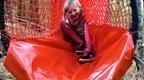 Child on a slide at Go Ape Nets Adventure
