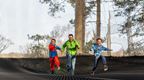 man and 2 boys running on Go Ape Nets Adventure