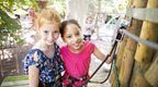 two girls smiling on Go Ape Treetop Adventure Plus