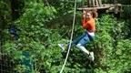 Woman in orange on Go Ape zipline | Fun Things to Do in Chelmsford for Adults