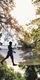 Silhouette of a person on crossing on Treetop Challenge at Go Ape Margam South Wales