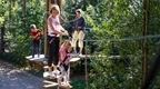 mother and girl on wooden crossing kids high ropes course