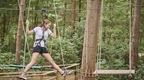 woman on Go Ape stirrups crossing