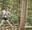 A woman on a Go Ape crossing at Trent Park, Cockfosters a great day out in London