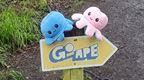 Go Ape sign with pink and blue octupus soft toys on top