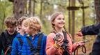 Group of children lining up for Go Ape Treetop Adventure 