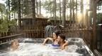 Family in hot tub at Forest Holiday location  