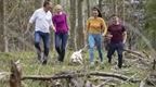 Family walking their dog on Forest Holiday