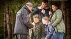 A Forest holidays ranger teaching a family