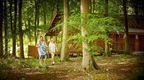 A family walking through the forest