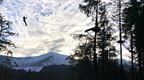 Go Ape instructor on zip line with Lake District views 