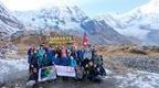 Go Ape Nepal group by the Annapurna base camp sign in Nepal