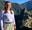 Kirsty Maitland stood in the Peruvian Mountains with Machu Pichu behind her