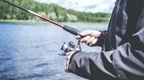 Person fishing by river | Fun Things to Do in The Forest of Dean