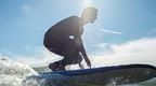Man rising on surf board in Devon | Fun Things to Do in Devon