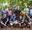 A group of colleagues wearing harnesses in the forest on a Go Ape team day