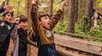 A group of boys celebrating on a Go Ape school trip