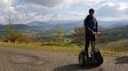 Man on Forest Segway with a view across the Lake District