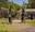 A man and women depart for a sunny bike ride in the forest