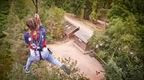 Woman in blue on a Go Ape zip | Adventure Awaits : Unforgettable UK Staycations