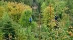 Two people on a zip trekking adventure at Go Ape Grizedale 