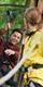 A woman looks back at a man smiling on a high ropes crossing in autumn as they enjoy an adventure using their Go Ape discount