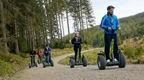 A group of people riding Go Ape Segways