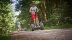 two men on forest segways in the forest at Go Ape  | how to plan a stag do