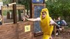 man in banana costume mid throw at Go Ape axe throwing  | how to plan a stag do
