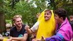 man in banana costume cheering and embracing friend  | how to plan a stag do