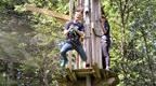 expressive woman jumping off Go Ape platform | How to plan a hen do