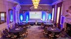 Circular tables with seating prepared for a conference at Coombe Abbey Hotel in the Midlands