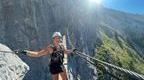 instructor posing on a via ferrata bridge in france  