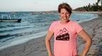 Bex Band on beach in pink love her wild t-shirt 