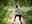 Woman in grey jumper on Go Ape Treetop Challenge zip line
