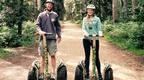 Doug and his daughter, lizzy, on Go Ape Segways 