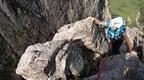 phoebe smith in blue rock climbing mountain